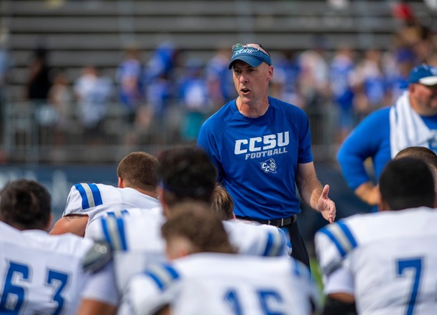 Ryan McCarthy speaks with the CCSU football team following its September 3 game at UConn. (Credit: Steve McLaughlin)